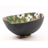 JOHN MALTBY (born 1936); an oval stoneware footed bowl with stepped rim and stylised floral