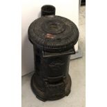 An early 20th century 'The Tortoise Stove Number 2' of cylindrical form with double-hinged front