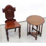 A Victorian mahogany hall chair with shield-shaped scroll back and turned tapering front legs,