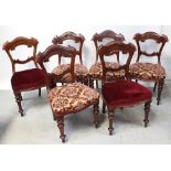 A set of six Victorian mahogany balloon-back dining chairs with curved top rails to turned baluster