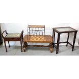 A nest of two mahogany glass-topped tables,