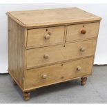 A small 19th century pine chest of two-over-two drawers with knob handles and on turned onion feet,