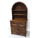 An early 20th century oak Jaycee Priory-style Welsh dresser of small proportions,