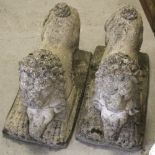 A pair of composite stone post head lions,