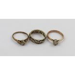 Three 9ct gold rings, a full eternity ring set with small white stones, size L,