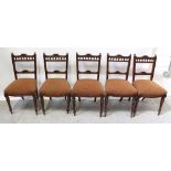 A set of five Edwardian walnut dining chairs with bobbin-turned gallery backs,