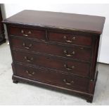 A George III oak chest of two-over-three drawers with mahogany cross-banding to the top and drawers,