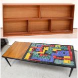 A c1960s retro coffee table, multi-coloured abstract mosaic tile top to tapering tubular supports,