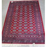 A modern red ground Bokhara rug, 200 x 140cm.