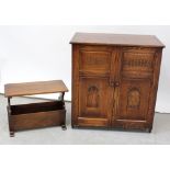 A stained oak two-door panelled cabinet with fixed shelves, height 93.