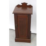 An Edward VII mahogany pot cupboard or night stand, with galleried back and panelled door,