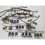 A quantity of white and yellow metal Afghan wedding and tribal jewellery to include bangles,