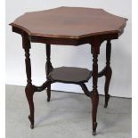 An early 20th century shaped octagonal red walnut table with reeded turned legs united by a shelf