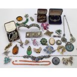 A quantity of vintage and contemporary costume jewellery to include various panther brooches,