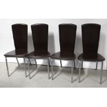 A set of six Italian designer brown leather chairs on tubular brushed steel legs,