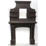 An early Victorian carved oak fireplace surround, mantel and overmantel mirror,