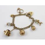 A 9ct gold link bracelet with eight charms to include a football, miners lamp,