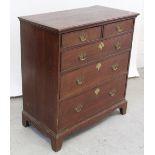 A George III rectangular oak chest of two-over-three graduated drawers,