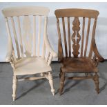 A pair of Edwardian high-back country-style chairs with central splat backs to curved armrests,