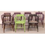 Seven painted captain-style pub chairs, four painted purple, one green,