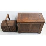 An early-to-mid 20th century oak panel blanket box and an oak drawer compartment sewing box,