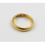 A 22ct gold ladies' wedding band, size M, approx 5g.