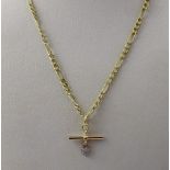 A 9ct gold link chain necklace with T-bar and tiny heart pendant set with small white stone,