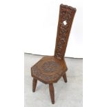 A late Victorian carved oak spinning stool,