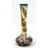 MOORCROFT; a floral tubeline decorated bottle vase, impressed marks and year cipher for 1999, height
