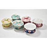 A collection of 20th century enamel decorated Chinese porcelain rice bowls and stands (two lacking