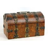A Victorian burr walnut and brass strapwork decorated dome topped stationery box with plaque