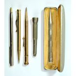 Three propelling pencils comprising cased silver plated Yard O Led and two gold plated examples, a