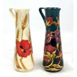 MOORCROFT; a white ground 'Harvest Poppy' pattern tubeline decorated slender tapered jug,