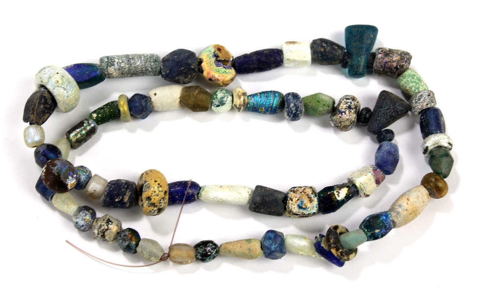 A Roman iridescent glass bead necklace, 1st century BC-1st century AD, approx 50cm.