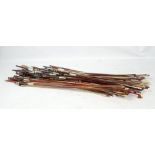 A bundle of assorted violin and cello bows (approximately 40).