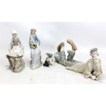 LLADRO; four figures to include a recumbent clown, length 35cm, a cat with mouse (af), and a girl