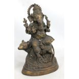 A 20th century Indian cast hollow brass figure of six handed Ganesha seated upon a mouse, on oval