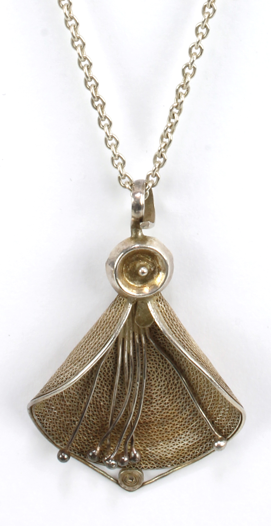 An Indian white metal floral pendant on chain.