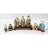 Three 20th century Chinese resin figures of immortals, two figures of boys and two porcelain