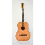 An early 20th century classical guitar with later fretwork detail.