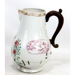 An 18th century Chinese porcelain jug painted with pair of birds amongst blossoming flowers, with