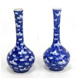 A pair of late 19th/early 20th century Chinese porcelain bottle vases decorated with stylised