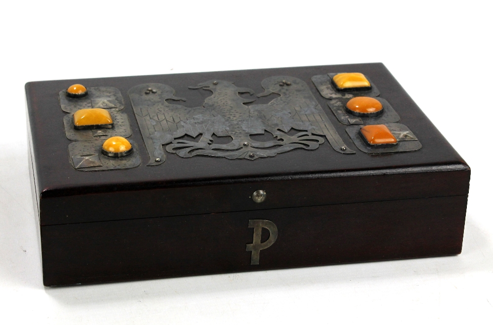 A Polish rectangular box, the lid decorated with metalwork and inset with Polish amber, width 24cm.