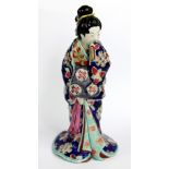 A 19th century Japanese Kutani two sectioned erotic figure of a geisha, the upper section