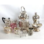 A small group of electroplated items to include a spirit kettle, a Georgian style biscuit barrel, an