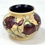 MOORCROFT; a cream ground floral tubeline decorated ovoid vase, impressed marks and year cipher