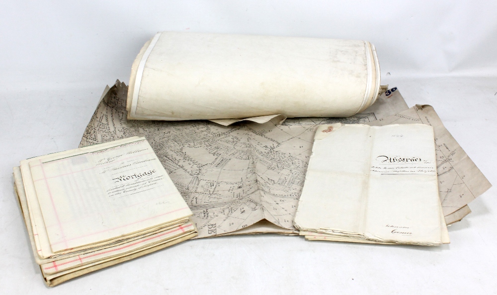 A collection of ordnance survey maps and deeds.