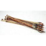 A bundle of assorted violin and cello bows (approximately 17).