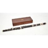 BLACKMAN OF LONDON; a rosewood 'Patent Improved' flute with hallmarked silver mounts and crest