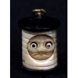 An early 20th century Japanese carved ivory and wooden mounted lantern ghost with 'popping' eyes,